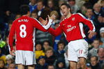 LONDON - NOVEMBER 30:  Robin Van Persie of Arsenal is congratulated by teammate Samir Nasre after scoring his team's second goal during the Barclays Premier League match between Chelsea and Arsenal at Stamford Bridge on November 30, 2008 in London, England.  (Photo by Clive Mason/Getty Images)