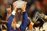 MIAMI - JANUARY 08:  Head coach Urban Meyer of the Florida Gators celebrates with the National Championship trophy after therir 24-14 win against the Oklahoma Sooners during the FedEx BCS National Championship game at Dolphin Stadium on January 8, 2009 in Miami, Florida.  (Photo by Doug Benc/Getty Images)
