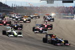 ISTANBUL, TURKEY - JUNE 07:  Sebastian Vettel (R) of Germany and Red Bull Racing leads Jenson Button (L) of Great Britain and Brawn GP into the first corner at the start of the Turkish Formula One Grand Prix at Istanbul Park on June 7, 2009, in Istanbul, Turkey.  (Photo by Paul Gilham/Getty Images)