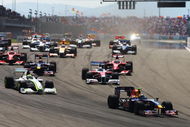 ISTANBUL, TURKEY - JUNE 07:  Sebastian Vettel (R) of Germany and Red Bull Racing leads Jenson Button (L) of Great Britain and Brawn GP into the first corner at the start of the Turkish Formula One Grand Prix at Istanbul Park on June 7, 2009, in Istanbul, Turkey.  (Photo by Paul Gilham/Getty Images)