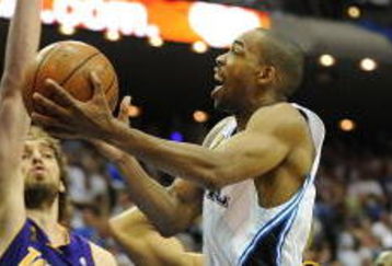 ORLANDO, FL - JUNE 09:  Rafer Alston #1 of the Orlando Magic lays the ball up over Pau Gasol #16 of the Los Angeles Lakers in Game Three of the 2009 NBA Finals on June 9, 2009 at Amway Arena in Orlando, Florida.  NOTE TO USER:  User expressly acknowledges and agrees that, by downloading and or using this photograph, User is consenting to the terms and conditions of the Getty Images License Agreement.  (Photo by Ronald Martinez/Getty Images)