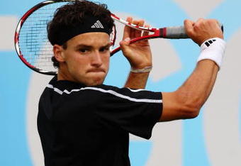 LONDON, ENGLAND - JUNE 10:  Grigor Dimitrov of Bulgaria plays a backhand during the men's second round match against Gilles Simon of France during Day 3 of the the AEGON Championship at Queens Club on June 10, 2009 in London, England.  (Photo by Ian Walton/Getty Images)
