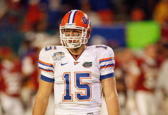 MIAMI - JANUARY 08:  Quarterback Tim Tebow #15 of the Florida Gators looks to the sideliens against the Oklahoma Sooners during the FedEx BCS National Championship Game at Dolphin Stadium on January 8, 2009 in Miami, Florida.  (Photo by Eliot J. Schechter/Getty Images