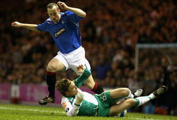 GLASGOW, UNITED KINGDOM - MARCH 06:  Charlie Adam of Rangers tackles Fritz Clemens of Werder Bremen during the UEFA Cup round of 16, first leg match at Ibrox Stadium March 6, 2008 in Glasgow,Scotland.  (Photo by Jeff J Mitchell/Getty Images)