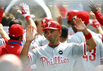 LOS ANGELES, CA - JUNE 06:  Raul Ibanez #29 of the Philadelphia Phillies is congratulated in the dugout after scoring on a hit by Matt Stairs in the seventh inning against the Los Angeles Dodgers at Dodger Stadium on June 6, 2009 in Los Angeles, California. The Dodgers defeated the Phillies 3-2 in twelve innings.  (Photo by Jeff Gross/Getty Images)