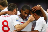 LONDON, ENGLAND - JUNE 10: Frank Lampard of England is congratulated by team mates Glen Johnson (C) and Theo Walcott (R) after he scores the second goal of the game during the FIFA 2010 World Cup Group 6 Qualifying match between England and Andorra at Wembley Stadium on June 10, 2009 in London, England. (Photo by Mark Thompson/Getty Images)