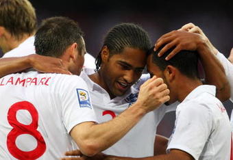 LONDON, ENGLAND - JUNE 10:  Frank Lampard of England is congratulated by team mates Glen Johnson (C) and Theo Walcott (R) after he scores the second goal of the game during the FIFA 2010 World Cup Group 6 Qualifying match between England and Andorra at Wembley Stadium on June 10, 2009 in London, England.  (Photo by Mark Thompson/Getty Images)