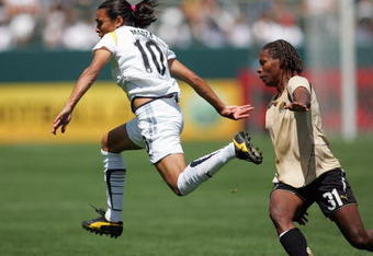 CARSON, CA - APRIL 19:  Marta #10 of the Los Angeles Sol runs against Formiga #31 of FC Gold Pride during the WPS match at The Home Depot Center on April 19, 2009 in Carson, California. (Photo by Victor Decolongon/Getty Images)