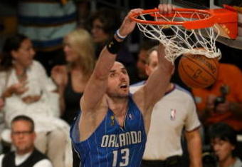 LOS ANGELES, CA - JUNE 04:  Marcin Gortat #13 of the Orlando Magic dunks the ball against the Los Angeles Lakers in the first half of Game One of the 2009 NBA Finals at Staples Center on June 4, 2009 in Los Angeles, California. NOTE TO USER: User expressly acknowledges and agrees that, by downloading and or using this photograph, User is consenting to the terms and conditions of the Getty Images License Agreement.  (Photo by Stephen Dunn/Getty Images)
