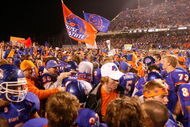 BOISE, ID - NOVEMBER 28: Boise State Broncos fans storm the field to celebrate their undefeated season and WAC championship after their game against the Fresno State Bulldogs on November 28, 2008 at Bronco Stadium in Boise, Idaho.  (Photo by Otto Kitsinger III/Getty Images)