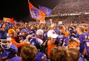 BOISE, ID - NOVEMBER 28: Boise State Broncos fans storm the field to celebrate their undefeated season and WAC championship after their game against the Fresno State Bulldogs on November 28, 2008 at Bronco Stadium in Boise, Idaho.  (Photo by Otto Kitsinger III/Getty Images)