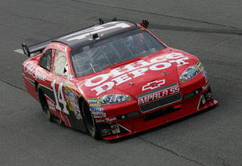 LONG POND, PA - JUNE 07:  Tony Stewart, driver of the #14 Office Depot/Old Spice Chevrolet, waves to the fans in celebration of winning the NASCAR Sprint Cup Series Pocono 500 on June 7, 2009 at Pocono Raceway in Long Pond, Pennsylvania.  (Photo by Todd Warshaw/Getty Images)