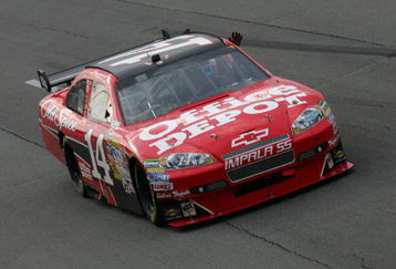 LONG POND, PA - JUNE 07:  Tony Stewart, driver of the #14 Office Depot/Old Spice Chevrolet, waves to the fans in celebration of winning the NASCAR Sprint Cup Series Pocono 500 on June 7, 2009 at Pocono Raceway in Long Pond, Pennsylvania.  (Photo by Todd Warshaw/Getty Images)