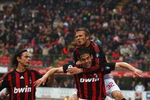 MILAN, ITALY - APRIL 26:  David Beckham of Milan jumps on the back of Kaka as Fillippo Inzaghi (L) joins to celebrate the first goal during the Serie A match between AC Milan and US Citta di Palermo at the San Siro Stadium on April 26, 2009 in Milan,Italy.  (Photo by Michael Steele/Getty Images)