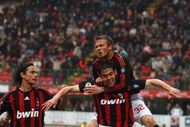 MILAN, ITALY - APRIL 26: David Beckham of Milan jumps on the back of Kaka as Fillippo Inzaghi (L) joins to celebrate the first goal during the Serie A match between AC Milan and US Citta di Palermo at the San Siro Stadium on April 26, 2009 in Milan,Italy. (Photo by Michael Steele/Getty Images)