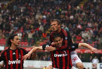 MILAN, ITALY - APRIL 26:  David Beckham of Milan jumps on the back of Kaka as Fillippo Inzaghi (L) joins to celebrate the first goal during the Serie A match between AC Milan and US Citta di Palermo at the San Siro Stadium on April 26, 2009 in Milan,Italy.  (Photo by Michael Steele/Getty Images)