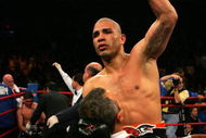 NEW YORK - FEBRUARY 21: Miguel Cotto is picked up by Evangelista Cotto to celebrate his 5th round TKO over Michael Jennings in their WBO World Welterweight title bout at Madison Square Garden on February 21, 2009 in New York City.  (Photo by Chris Trotman/Getty Images)
