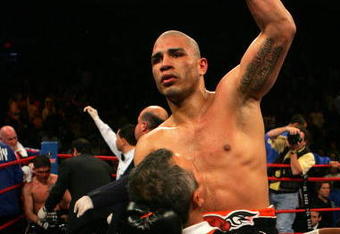 NEW YORK - FEBRUARY 21: Miguel Cotto is picked up by Evangelista Cotto to celebrate his 5th round TKO over Michael Jennings in their WBO World Welterweight title bout at Madison Square Garden on February 21, 2009 in New York City.  (Photo by Chris Trotman/Getty Images)