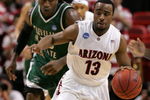 MIAMI - MARCH 22:  Guard Nic Wise #13 of the  University of Arizona Wildcats steals the ball from forward J'Nathan Bullock (L) of the Cleveland State University Vikings during the second round of the NCAA Division I Men's Basketball Tournament at the American Airlines Arena on March 22, 2009 in Miami, Florida.  (Photo by Marc Serota/Getty Images)