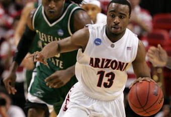 MIAMI - MARCH 22:  Guard Nic Wise #13 of the  University of Arizona Wildcats steals the ball from forward J'Nathan Bullock (L) of the Cleveland State University Vikings during the second round of the NCAA Division I Men's Basketball Tournament at the American Airlines Arena on March 22, 2009 in Miami, Florida.  (Photo by Marc Serota/Getty Images)