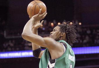 CHARLOTTE, NC - MARCH 16:  Chris Bosh #4 of the Toronto Raptors makes a jumpshot against the Charlotte Bobcats during their game at Time Warner Cable Arena on March 16, 2009 in Charlotte, North Carolina.  NOTE TO USER: User expressly acknowledges and agrees that, by downloading and/or using this Photograph, user is consenting to the terms and conditions of the Getty Images License Agreement. (Photo by: Streeter Lecka/Getty Images)