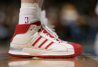 DENVER - NOVEMBER 18:  A detail of the footware of Austin Croshere #44 of the Milwaukee Bucks as he awaits action against the Denver Nuggets at the Pepsi Center on November 18, 2008 in Denver, Colorado. The Nuggets defeated the Bucks 114-105.  (Photo by Doug Pensinger/Getty Images)