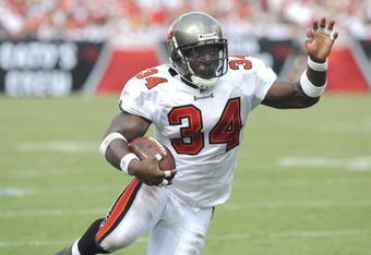 TAMPA, FL - SEPTEMBER 14: Running back Earnest Graham #34 of  the Tampa Bay Buccaneers rushes upfield against the Atlanta Falcons at Raymond James Stadium on September 14, 2008 in Tampa, Florida.  (Photo by Al Messerschmidt/Getty Images)