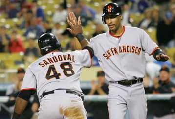 LOS ANGELES, CA - SEPTEMBER 19:  (L-R) Pablo Sandoval #48 and teammate Randy Winn #2 of the San Francisco Giants celebrate after scoring in the first inning against the Los Angeles Dodgers at Dodger Stadium on September 19, 2008 in Los Angeles, California.  (Photo by Lisa Blumenfeld/Getty Images)