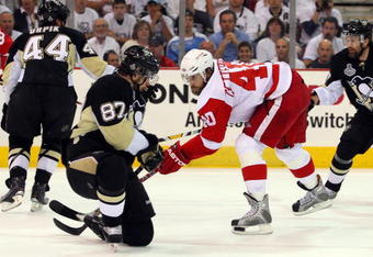 PITTSBURGH - JUNE 09:  Henrik Zetterberg #40 of the Detroit Red Wings has his shot blocked by Sidney Crosby #87 of the Pittsburgh Penguins during Game Six of the NHL Stanley Cup Finals at the Mellon Arena on June 9, 2009 in Pittsburgh, Pennsylvania.  (Photo by Jim McIsaac/Getty Images)