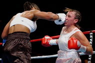 BILOXI, MS - AUGUST 23: Laila Ali lands a punch on Christy Martin on August 23, 2003 at the Mississippi Coast Coliseum in Biloxi, Mississippi. Ali defeated Martin in the fourth round. (Photo by Chris Graythen/Getty Images)