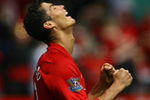 MANCHESTER, ENGLAND - MAY 16:  Cristiano Ronaldo of Manchester United celebrates as the final whistle is blown and his side clinch the Premier League title at the end of the Barclays Premier League match between Manchester United and Arsenal at Old Trafford on May 16, 2009 in Manchester, England.  (Photo by Alex Livesey/Getty Images)
