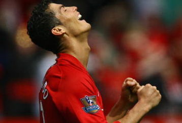 MANCHESTER, ENGLAND - MAY 16:  Cristiano Ronaldo of Manchester United celebrates as the final whistle is blown and his side clinch the Premier League title at the end of the Barclays Premier League match between Manchester United and Arsenal at Old Trafford on May 16, 2009 in Manchester, England.  (Photo by Alex Livesey/Getty Images)