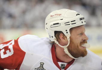 PITTSBURGH - JUNE 9:  Johan Franzen #93 of the Detroit Red Wings looks on the ice against the Pittsburgh Penguins during Game Six of the NHL Stanley Cup Finals at the Mellon Arena on June 9, 2009 in Pittsburgh, Pennsylvania. (Photo by: Harry How/Getty Images)