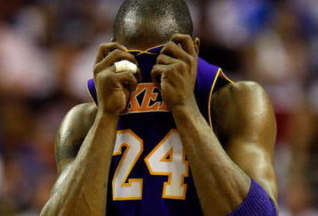 ORLANDO, FL - JUNE 09:  Kobe Bryant #24 of the Los Angeles Lakers wipes his face during the game against the Orlando Magic in Game Three of the 2009 NBA Finals on June 9, 2009 at Amway Arena in Orlando, Florida.  NOTE TO USER:  User expressly acknowledges and agrees that, by downloading and or using this photograph, User is consenting to the terms and conditions of the Getty Images License Agreement.  (Photo by Ronald Martinez/Getty Images)