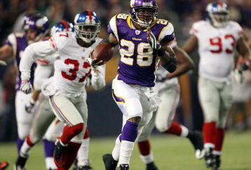 MINNEAPOLIS - DECEMBER 28:   Adrian Peterson #28 of the Minnesota Vikings runs the ball in for a touchdown as James Butler of the New York Giants defends on December 28, 2008 at the Hubert H. Humphrey Metrodome in Minneapolis, Minnesota. The Vikings defeated the Giants 20-19. (Photo by Elsa/Getty Images)