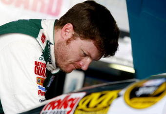 DOVER, DE - MAY 30:  Dale Earnhardt Jr. looks over the engine of the #88 AMP Energy/National Guard Chevrolet in the garage during practice for the NASCAR Sprint Cup Series Autism Speaks 400 at Dover International Speedway on May 30, 2009 in Dover, Delaware.  (Photo by Jason Smith/Getty Images for NASCAR)
