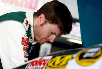 DOVER, DE - MAY 30:  Dale Earnhardt Jr. looks over the engine of the #88 AMP Energy/National Guard Chevrolet in the garage during practice for the NASCAR Sprint Cup Series Autism Speaks 400 at Dover International Speedway on May 30, 2009 in Dover, Delaware.  (Photo by Jason Smith/Getty Images for NASCAR)
