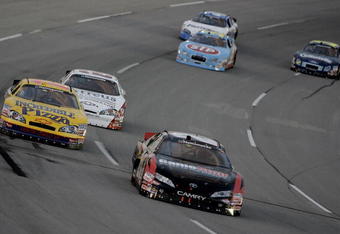 SPARTA, KY - JUNE 14:  Joey Logano (C) driver of the #20 GameStop Toyota leads the NASCAR Nationwide Series Meijer 300 race presented by Oreo at the Kentucky Speedway June 14, 2008 in Sparta, Kentucky.  (Photo by John Sommers II/Getty Images)