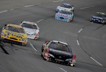 SPARTA, KY - JUNE 14:  Joey Logano (C) driver of the #20 GameStop Toyota leads the NASCAR Nationwide Series Meijer 300 race presented by Oreo at the Kentucky Speedway June 14, 2008 in Sparta, Kentucky.  (Photo by John Sommers II/Getty Images)