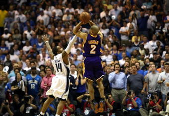 ORLANDO, FL - JUNE 11:  Derek Fisher #2 of the Los Angeles Lakers shoots a game-tying three-point shot over Jameer Nelson #14 of the Orlando Magic in the fourth quarter of Game Four of the 2009 NBA Finals on June 11, 2009 at Amway Arena in Orlando, Florida.  NOTE TO USER:  User expressly acknowledges and agrees that, by downloading and or using this photograph, User is consenting to the terms and conditions of the Getty Images License Agreement.  (Photo by Elsa/Getty Images)