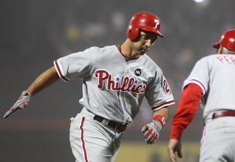 NEW YORK - JUNE 11: Raul Ibanez #29 of the Philadelphia Phillies celebrates his 3 run home run in the tenth inning with third base coach Sandy Alomar #2 against the New York Mets on June 11, 2009 at Citi Field in the Flushing neighborhood of the Queens borough of New York City. (Photo by Nick Laham/Getty Images)