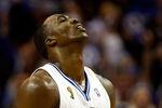 ORLANDO, FL - JUNE 11:  Dwight Howard #12 of the Orlando Magic reacts in Game Four of the 2009 NBA Finals against the Los Angeles Lakers on June 11, 2009 at Amway Arena in Orlando, Florida.  NOTE TO USER:  User expressly acknowledges and agrees that, by downloading and or using this photograph, User is consenting to the terms and conditions of the Getty Images License Agreement.  (Photo by Chris Graythen/Getty Images)