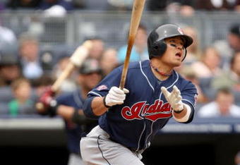 NEW YORK - APRIL 19:  Shin-soo Choo #17 of the Cleveland Indians hits a home run in the second inning of their game against the New York Yankees at Yankee Stadium on April 19, 2009 in the Bronx borough of New York City.  (Photo by Ezra Shaw/Getty Images)