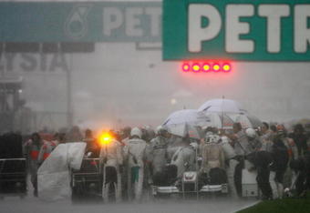 KUALA LUMPUR, MALAYSIA - APRIL 05:  Cars line up on the start finish straight as the race is red flagged and then abandoned due to heavy rain during the Malaysian Formula One Grand Prix at the Sepang Circuit on April 5, 2009 in Kuala Lumpur, Malaysia.  (Photo by Paul Gilham/Getty Images)