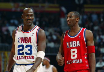 ATLANTA - FEBRUARY 9:  Michael Jordan (Washington Wizards) #23 of the Eastern Conference All-Stars talks with Kobe Bryant (Los Angeles Lakers) #8 of the Western Conference All-Stars at the 2003 NBA All-Star Game on February 9, 2003 at Philips Arena in Atlanta, Georgia.  NOTE TO USER:  User expressly acknowledges and agrees that, by downloading and or using this photograph, user is consenting to the terms and conditions of the Getty Images license agreement. (Photo by Jamie Squire/Getty Images)