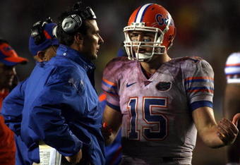 TALLAHASSEE, FL - NOVEMBER 29:  Head coach Urban Meyer of the Florida Gators chats with quarterback Tim Tebow #15 during a game against the Florida State Seminoles at Bobby Bowden Field at Doak Campbell Stadium on November 29, 2008 in Tallahassee, Florida. The Gators defeated the Seminoles 45-15.  (Photo by Marc Serota/Getty Images)