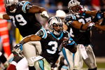 CHARLOTTE, NC - JANUARY 10:  DeAngelo Williams #34 of the Carolina Panthers runs with the ball against  the Arizona Cardinals during the NFC Divisional Playoff Game on January 10, 2009 at Bank of America Stadium in Charlotte, North Carolina. The Arizona Cardinals defeated the Carolina Panthers with a score of 33-13.  (Photo by Streeter Lecka/Getty Images)