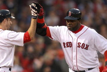 BOSTON - JUNE 11:  David Ortiz #34 of the Boston Red Sox hits a home run and celebrates with teammate Rocco Baldelli against the New York Yankees at Fenway Park on June 11, 2009 in Boston, Massachusetts.  (Photo by Jim Rogash/Getty Images)