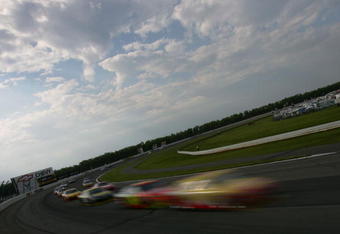 LONG POND, PA - JUNE 07:  A pack of cars race during the NASCAR Sprint Cup Series Pocono 500 on June 7, 2009 at Pocono Raceway in Long Pond, Pennsylvania.  (Photo by Todd Warshaw/Getty Images)