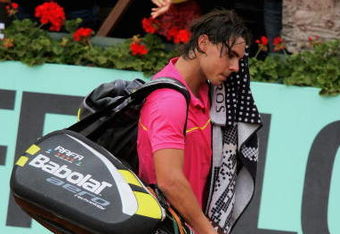 PARIS - MAY 31:  Defeated champion Rafael Nadal of Spain walks off court following his defeat during the Men's Singles Fourth Round match against Robin Soderling of Sweden on day eight of the French Open at Roland Garros on May 31, 2009 in Paris, France.  (Photo by Matthew Stockman/Getty Images)
